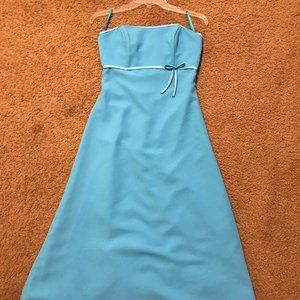 Formal long blue dress with ribbon on front